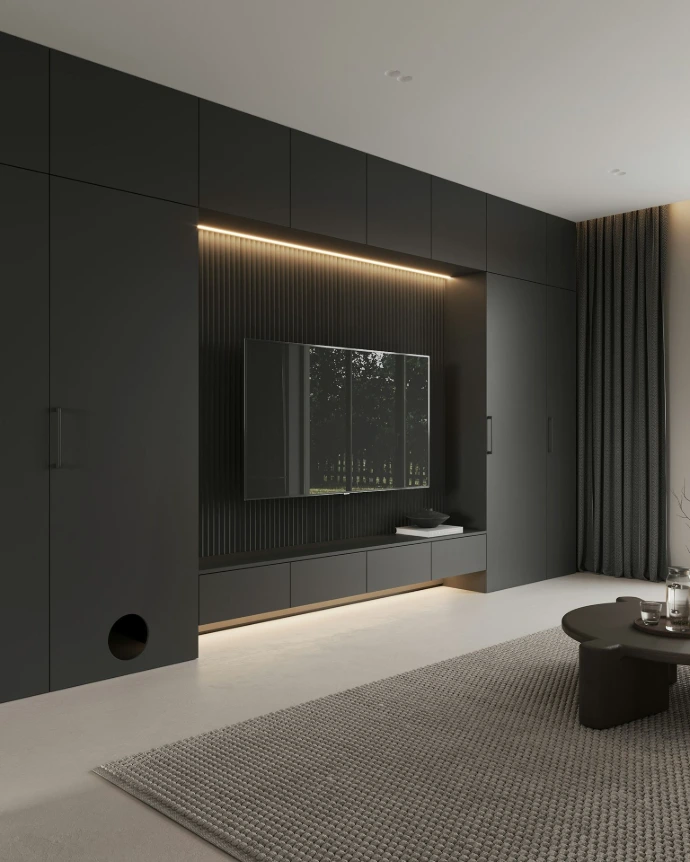 A living room with a couch, coffee table and television